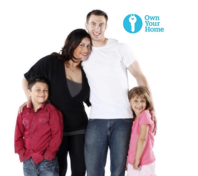 Family standing together promoting affordable home ownership and housing support services